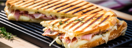 ham and cheese panini on a griddle